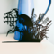A black papercut of two cranes at the shore with Ani L’Dodi V’Dodi Li in Hebrew, suspended between them. Handmade, wall art